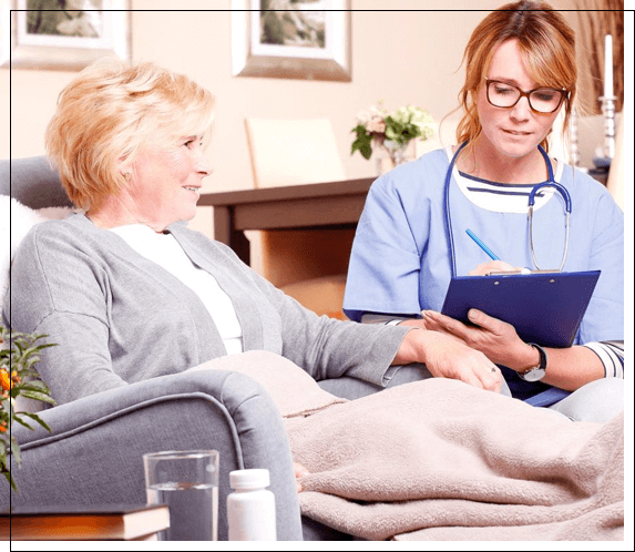 A Healthcare Worker Sitting By A Man Image