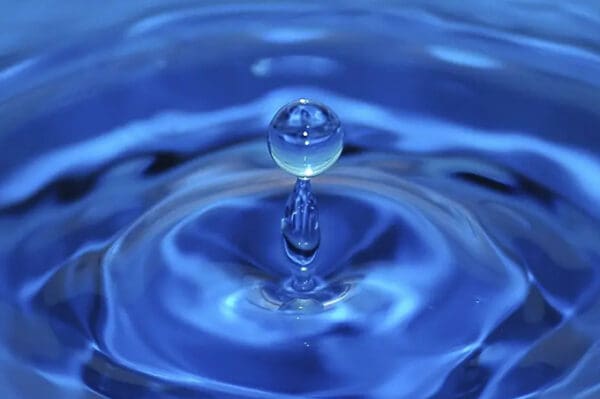 A water drop is shown in the air.